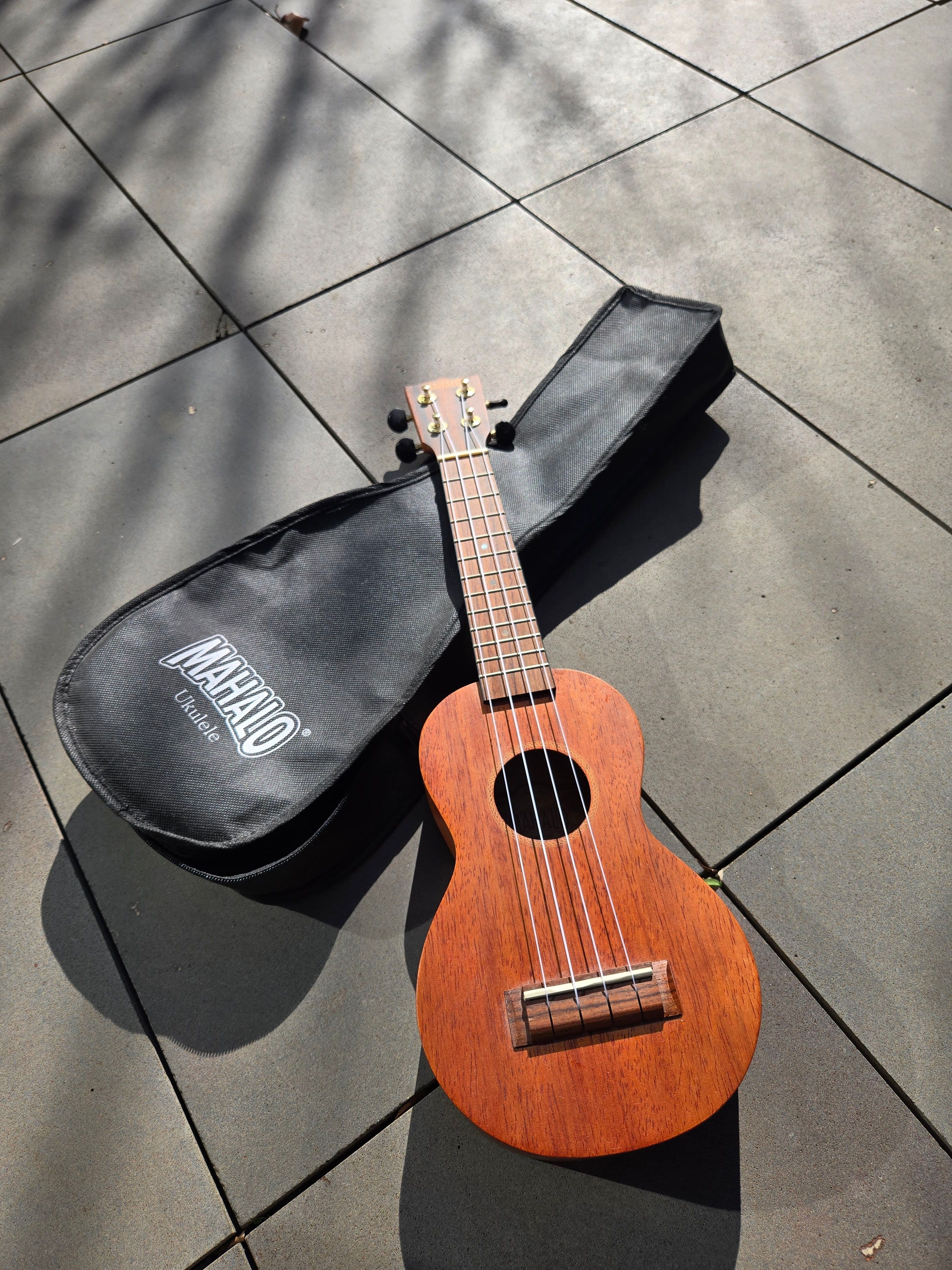Brown Wooden Ukulele, photo 1 of 3